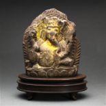 Himalayan polychrome stone Ganesha, seated in laliasana with various attributes in hand, raised on