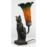 Art Deco style lamp, the base in the form of a seated cat, its tail issuing the glass shade, 12"h