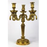 French Louis XVI gilt bronze candelabrum, having three arms with garland swag supports above the
