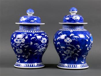 Pair of Chinese underglaze blue porcelain lidded jars, featuring prunus on a cracked-ice ground - Image 2 of 4