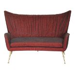 Italian Modern sofa, circa 1950, in the manner of Gio Ponti, executed in burgundy, having a wing