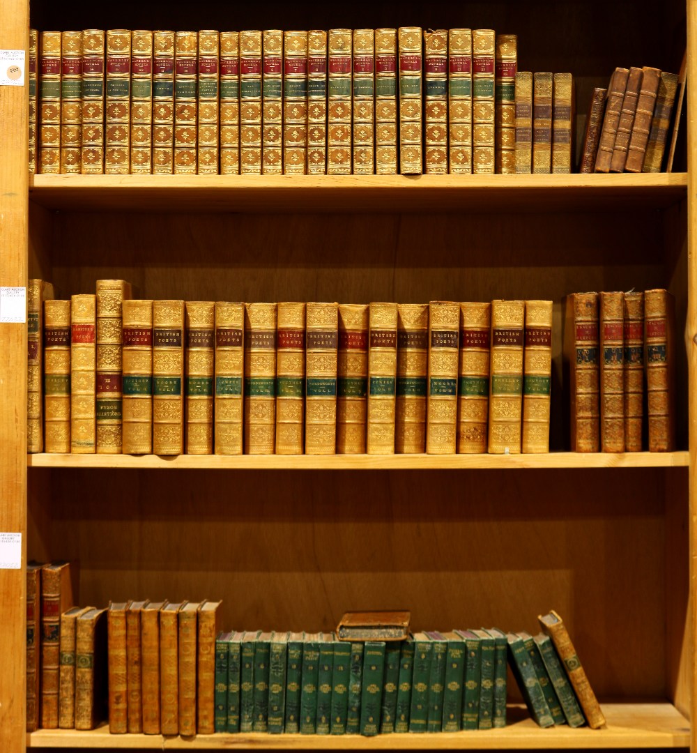 Three shelves of leather bound books, mostly relating to literature, including British Poets,