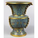 Chinese cloisonne enameled gu-form vase, with a turquoise ground, the body enameled with blue