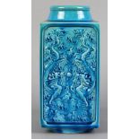 Chinese turquoise glazed porcelain vase, of cong form molded with reserves of a pair of