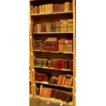 Six shelves of mostly leather bound books relating to literature, including "Le Vicomte de