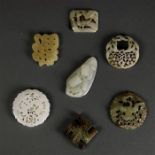 (lot of 7) Chinese hardstone toggles and plaques, including a pierced 'fu' character; three