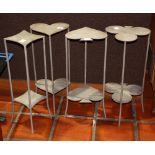(lot of 4) French Industrial Age occasional tables, each executed in paint decorated metal,