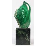 Polished malachite cartouche, etched with Egyptian hieroglyphics, the whole rising on a jadeite