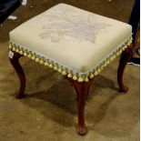 Chippendale style ottoman, having floral decorated upholstery and rising on cabriole legs, 19"h x