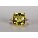 Green quartz, diamond and 14k yellow gold ring Featuring (1) faceted top green quartz, weighing