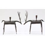 Pair of Moderne patinated metal figural candlesticks, each having a single light above a deer form