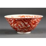 Chinese iron red decorated porcelain bowl, interior with a child amid lotus scrolls painted in red