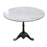French bistro table, having a carerra marble top above the cast iron gueridon base, 28.5"h x 40"w;