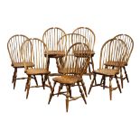 (lot of 8) David T. Smith Windsor style chairs, each having a spindle back, above a shaped seat