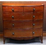 George III mahogany bow front chest, having a shaped crest, above the five drawer case, and rising