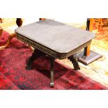 Aesthetic Movement occasional table, having a marble top, above a partial gilt and ebonized base,