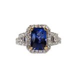 Sapphire, diamond and 18k white gold ring Featuring (1) cushion-cut blue sapphire, weighing 4.35