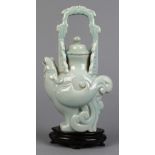 Chinese clair de lune porcelain ewer, in the form of a stylized bird, with handle formed by a pair