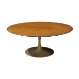 Eero Saarinen for Knoll and Associates low table, having a circular walnut top over the painted