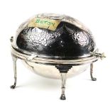 Edwardian silverplate asparagus server, having a hinged dome top and rising on four long paw feet,