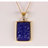 Tanzanite, diamond and 18k yellow gold pendant-necklace Featuring (1) carved foliate motif