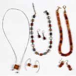 (Lot of 3) Amber, agate, plastic, silver, and metal jewelry suites Including 1) amber cube, silver