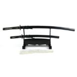 (lot of 4) Japanese style katana, wakizashi, black laquered wooden katana stand, a silk pouch,