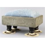 Folk Art foot stool, havig an embroidered cushion, cement frame, and rising on four shaving