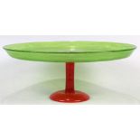 Schneider glass compote, having a dish top executed in lime green, above the mottled orange base,