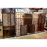 (lot of 9) Chinese reticulated wood panels, seven of openwork wanzi pattern; together with a pair