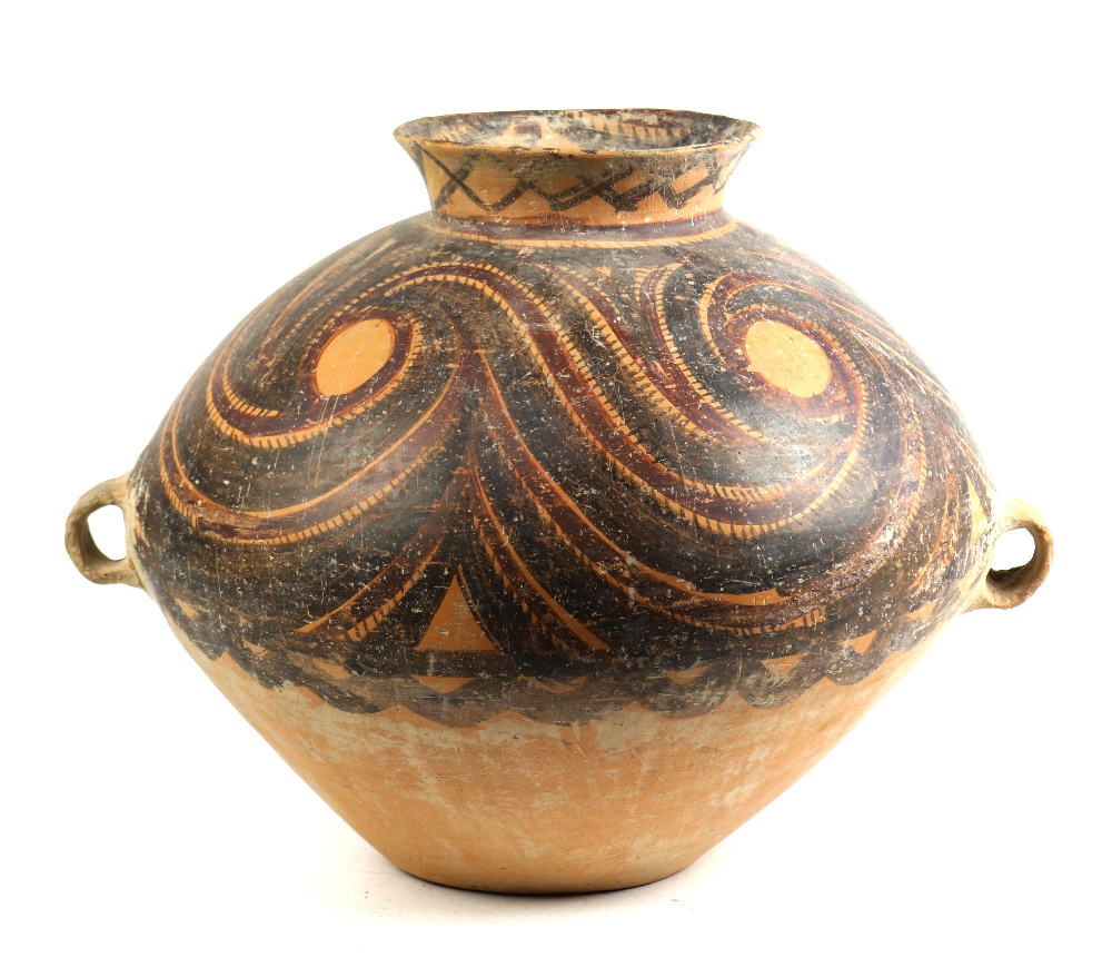 Chinese Neolithic style pottery jar, with an everted rim above the rounded shoulder decorated with