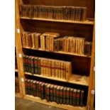 Four shelves of monthly leather bound books, including Bibliotheque Universelle Des Dames, The