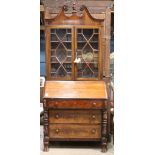 American Classical mahogany secretary, early 19th century, having a broken pediment top, above