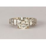 Diamond and 18k white gold ring Featuring (1) round brilliant-cut diamond, weighing approximately