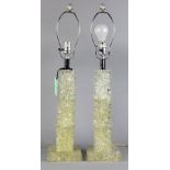 Pair of Mid-Century acrylic table lamps, each having a pillar form, in three cubes, above a plinth