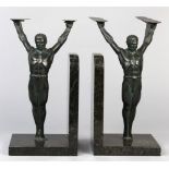 Pair of German Art Deco figural bronze bookends on marble bases, each depicting an athletic winged