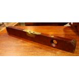 Antique level executed in mahogany and brass, 3"h x 26"w