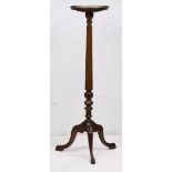 Chippendale style walnut plant stand, having a circular dish top above the turned standard, and