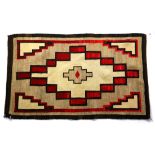 Navajo rug, having geometric designs in red and brown on a cream and grey ground, 2'11" x 4'10"
