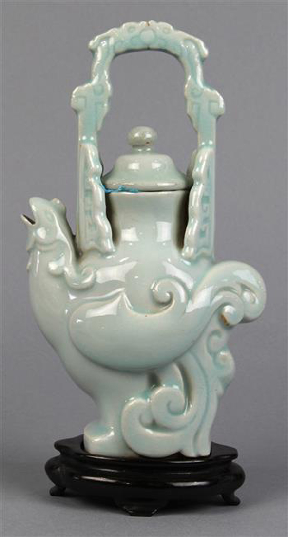 Chinese clair de lune porcelain ewer, in the form of a stylized bird, with handle formed by a pair