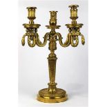 French Louis XVI gilt bronze candelabrum, having three arms with garland swag supports above the