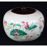 Chinese enameled porcelain jar, the compressed body decorated with an egret in a lotus pond,