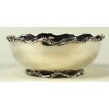 Mexican sterling silver serving bowl, having a scallop rim and rising on a reticulated footed