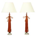 Pair of custom designed table lamps, each having a single light with a standard decorated with a