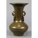 Chinese tea dust glazed porcelain vase, with a trumpet neck flanked by mock loose ring handles, 9"h