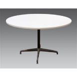 Mid-Century Modern dining table, in the manner of Charles and Ray Eames, having a circular white