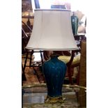 Chinese style table lamp, having a tapered body with blue glaze and rising on a gilt base, 33"h