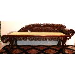 Chinese wood settee, with a leaf form back splat and a scroll form arm on the left, the woven seat