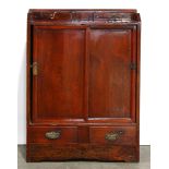 Korean reddish brown lacquered cabinet, two small drawers above a sliding door section with an