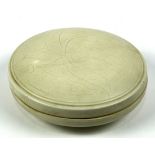 Chinese Ding type ceramic circular box, the lid incised with stylized foliage, base marked, 6"w